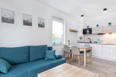 This angle showcases an open-plan layout where the living room flows into the kitchen area, creating a spacious and unified look.