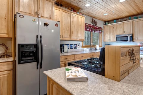 Contemporary kitchen with clean lines and warm wood cabinetry.