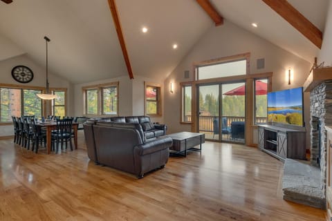 - Living room with stone fireplace and TV  
- Dining area with large windows and views  
- Tahoe vacation rental with cozy great room