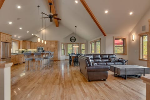 - Open floor plan with vaulted ceilings  
- Kitchen, dining, and living space combined  
- Tahoe cabin rental with modern family design