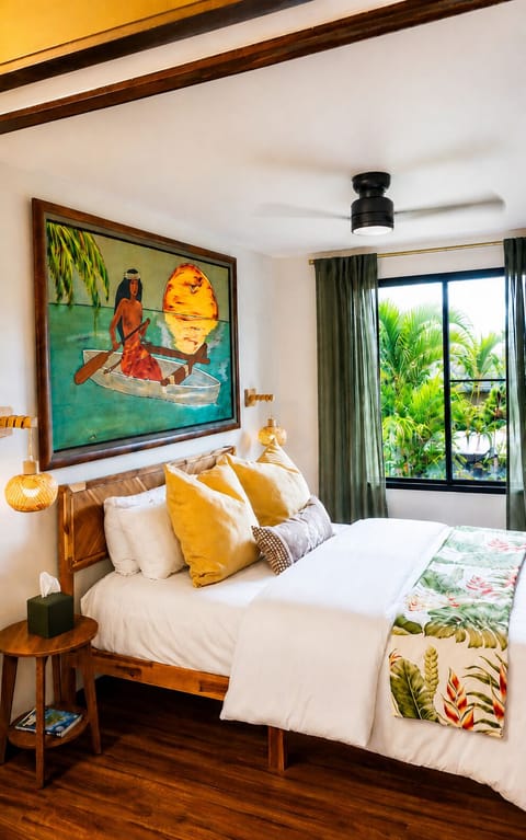 Comfortable Queen sized bed with nightstands on each side and hanging lamps!