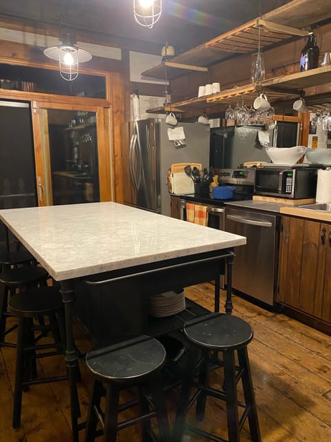 Open concept kitchen with stainless appliances