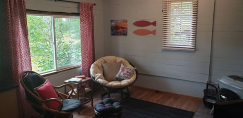 Seating with a view next to a very nice and cozy woodstove for chilly nights