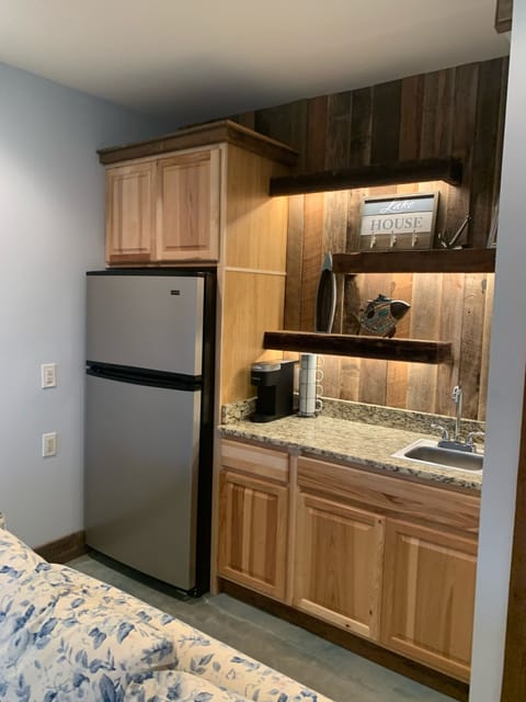 Bar and 2nd fridge for additional storage on the lower level.