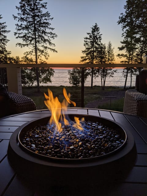 Back deck gas fire ring . Place to enjoy Michigan sunsets.