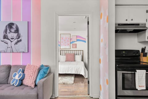 Fun and vibrant living room with bold colors, comfy seating, and a cheerful vibe that makes you feel right at home.