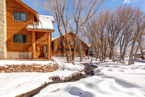 Enjoy the rustic beauty of your snowy Park City retreat with cozy lodge architecture and forest views.