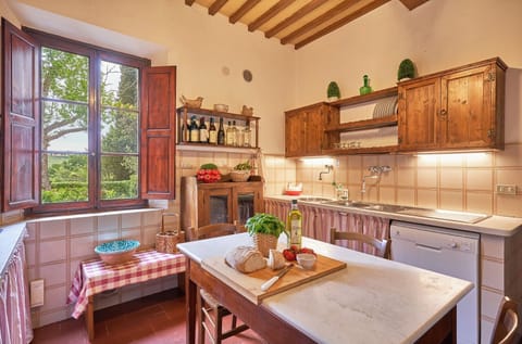 Immerse yourself in the flavors of Italy in this traditional Tuscan kitchen