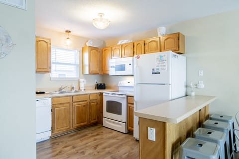 The kitchen is stocked with all the appliances and cookware you need for meals.