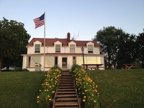 View of home from deck by lake