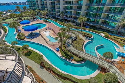 Lazy river, outdoor pools, waterslide, and putting green