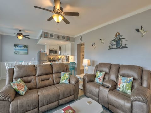 Living room with new leather reclining sofa and loveseat
