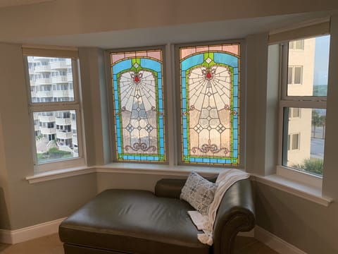 Lounging/reading nook with custom glass to allow privacy from bldg next door