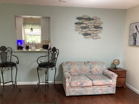 Looking toward kitchen. Love seat has a pull out single hide a bed.