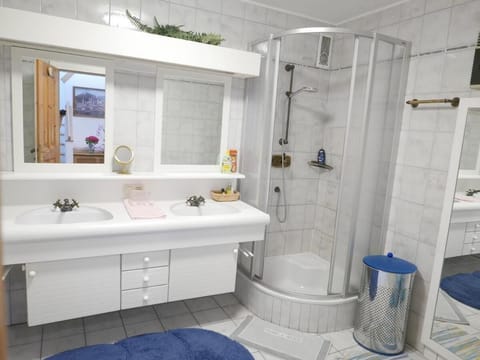 Bathtub, towels, soap, toilet paper