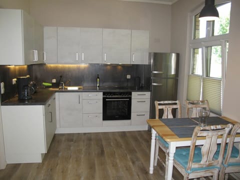 Room, Furniture, Kitchen, Property, Countertop, Cabinetry, Floor, Wood Flooring, Interior Design, Building