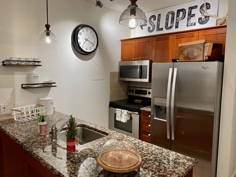 Full kitchen complete with directions to skiing
