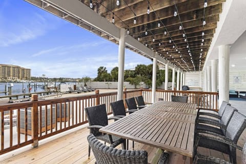 Covered balcony w/ outdoor dining & elevated views over the surrounding area