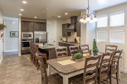 Dining Table - The beautiful wood dining room set can comfortably seat 8 people.