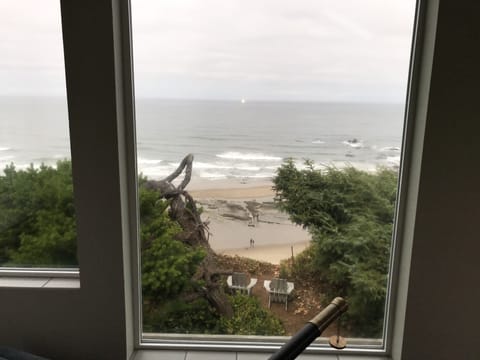 Front room view of the beach and the rocks