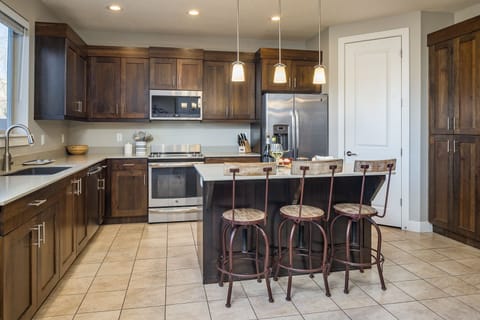 Fully Stocked Kitchen with appliances and counter area  / Island