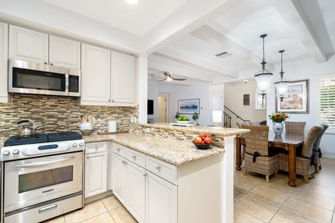 Kitchen opens to dining area