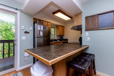 The kitchen features stainless steel appliances.