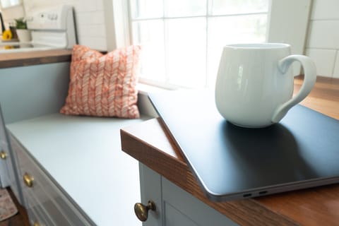 The window seat in the kitchen is a great place to cozy up with some hot coffee