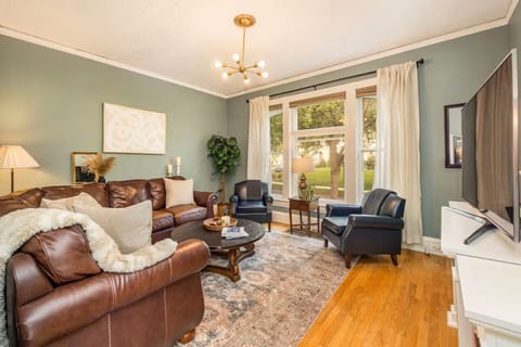 Relax together in a sunlit living room with spacious seating in Milwaukee