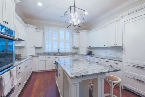 Built-in cabintry conceals the refrigerator, freezer and dishwasher.