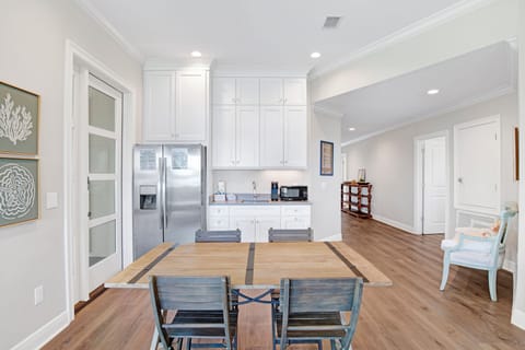 The kitchenette has a fridge, sink and microwave