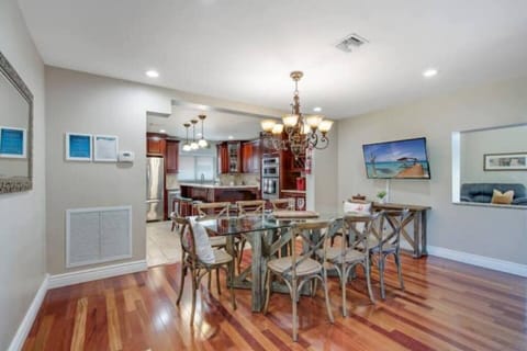 Open dining area seats 8 with easy access to kitchen.