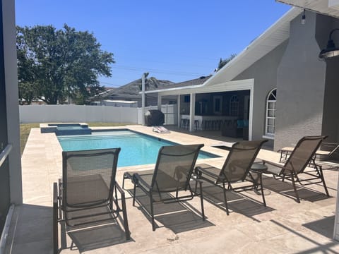 Fenced in backyard for privacy. Many lounge chairs!