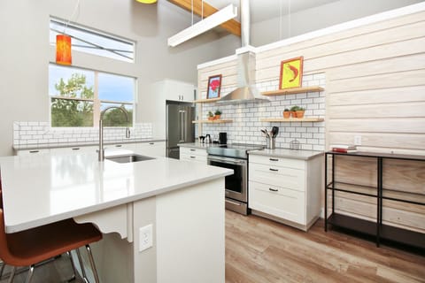 Full kitchen with stainless steel appliances