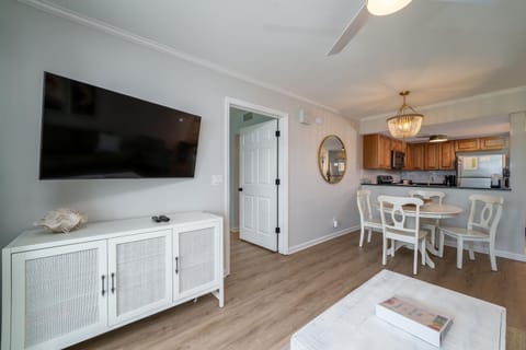 The floor plan is open and inviting. Kitchen looks onto dining room which flows into living area.