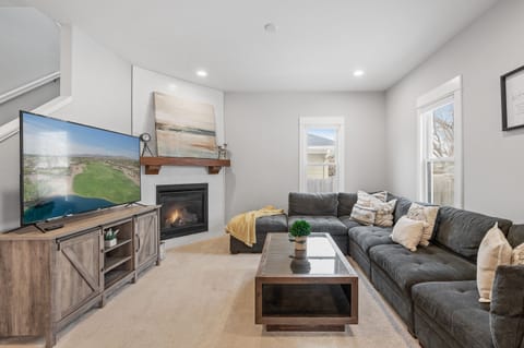 Your living room awaits with comfy seating. Fireplace is great for cozy winters!