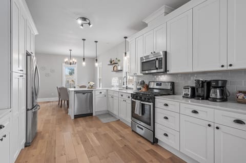 Stocked kitchen w/ toaster, Mr Coffee, Keurig, pots, pans, utensils, sevingware