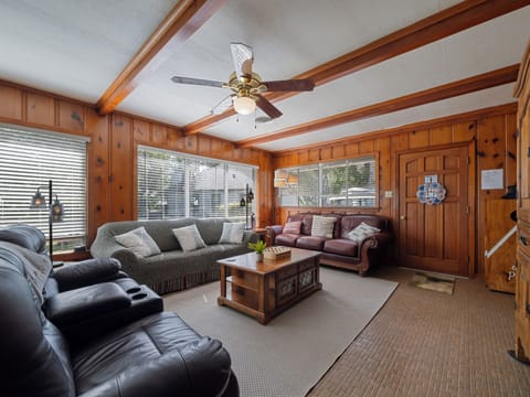 Living Room with plenty of seating, smart TV, DVD player, DVDs & board games.