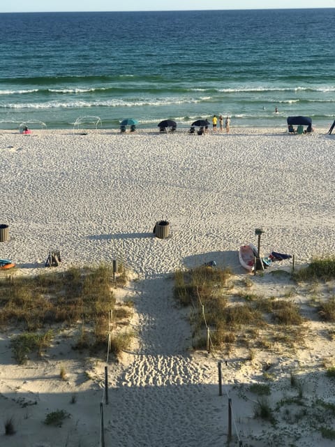 View from living room balcony. Only a few steps to the white sand! 