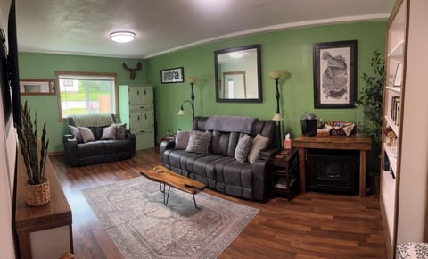 You can find the microwave and mini fridge in the green corner cabinet.