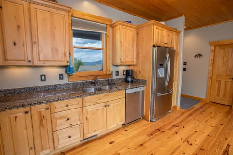 Double Stainless Undermount Kitchen Sink and Custom Wood Cabinetry