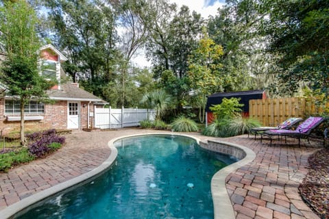 Fenced Yard with private pool, lounger area and tiki hut with built in BBQ!
