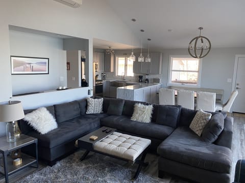 Comfortable living room sectional, 2 chairs with gas fireplace, satellite TV