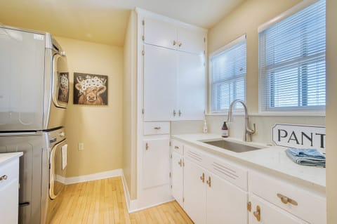 Fully stocked pantry with laundry and sink