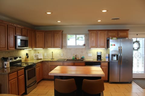 Kitchen with all appliances and cookware