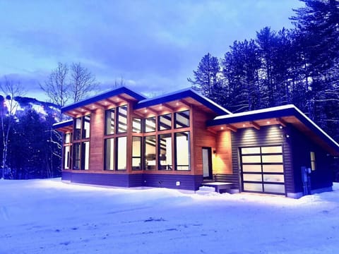 Stunning exterior of home with views of Cranmore Mountain skiing trails. Mountain is just a 6 minute walk away.