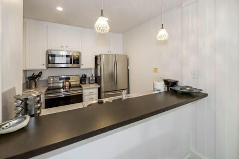 Fully equipped kitchen with dishes, pots and pans, cooking utensils, and everything you need to serve up some tasty meals!