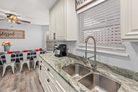 Fully-stocked and well-appointed kitchen with custom granite & cabinets, dining room, and more. Located on 2nd floor (main floor).