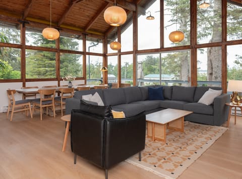 Living area with tall ceilings and windows that let in tons of natural light.