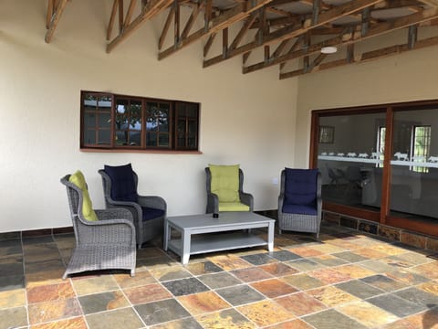 Spacious, private Stoep  with comfortable chairs and braai
